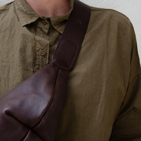 Chestnut leather Sling Bag crafted by Paula Kirkwood.