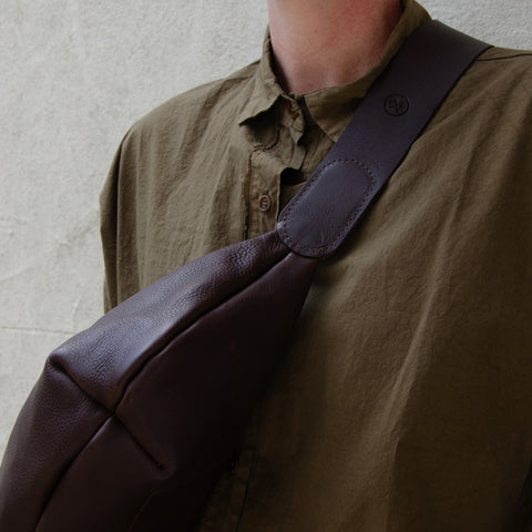 Chestnut leather Sling Bag crafted by Paula Kirkwood.