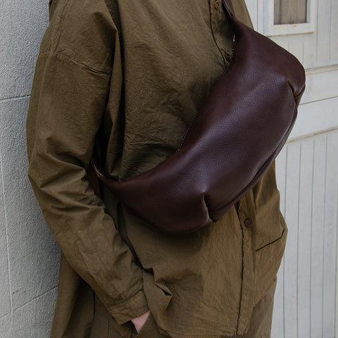Chestnut leather Sling Bag crafted by Paula Kirkwood.