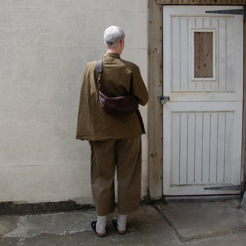 Chestnut leather Sling Bag crafted by Paula Kirkwood.