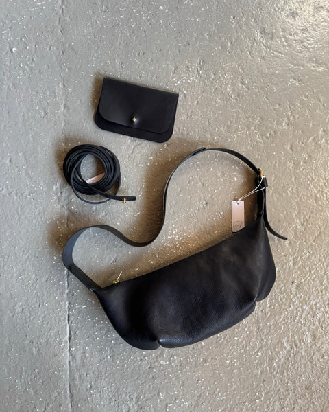 Black leather Sling Bag crafted by Paula Kirkwood.