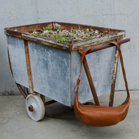 Tan leather Sling Bag crafted by Paula Kirkwood.