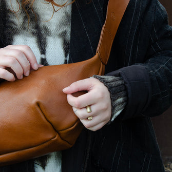 Tan leather Sling Bag crafted by Paula Kirkwood.