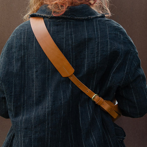 Tan leather Sling Bag crafted by Paula Kirkwood.