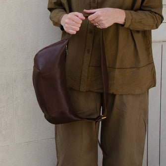 Chestnut leather Sling Bag crafted by Paula Kirkwood.