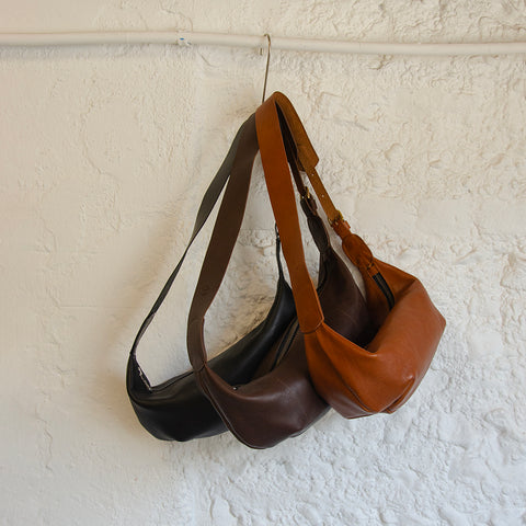 Brown leather Sling Bag crafted by Paula Kirkwood.