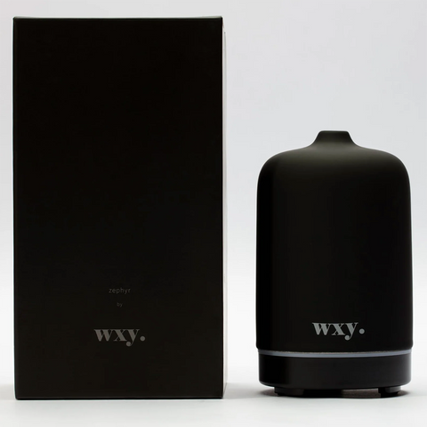 Black ceramic electronic diffuser with box, plug. Variable time length and colour change settings