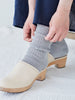 Pale grey linen socks worn with clogs